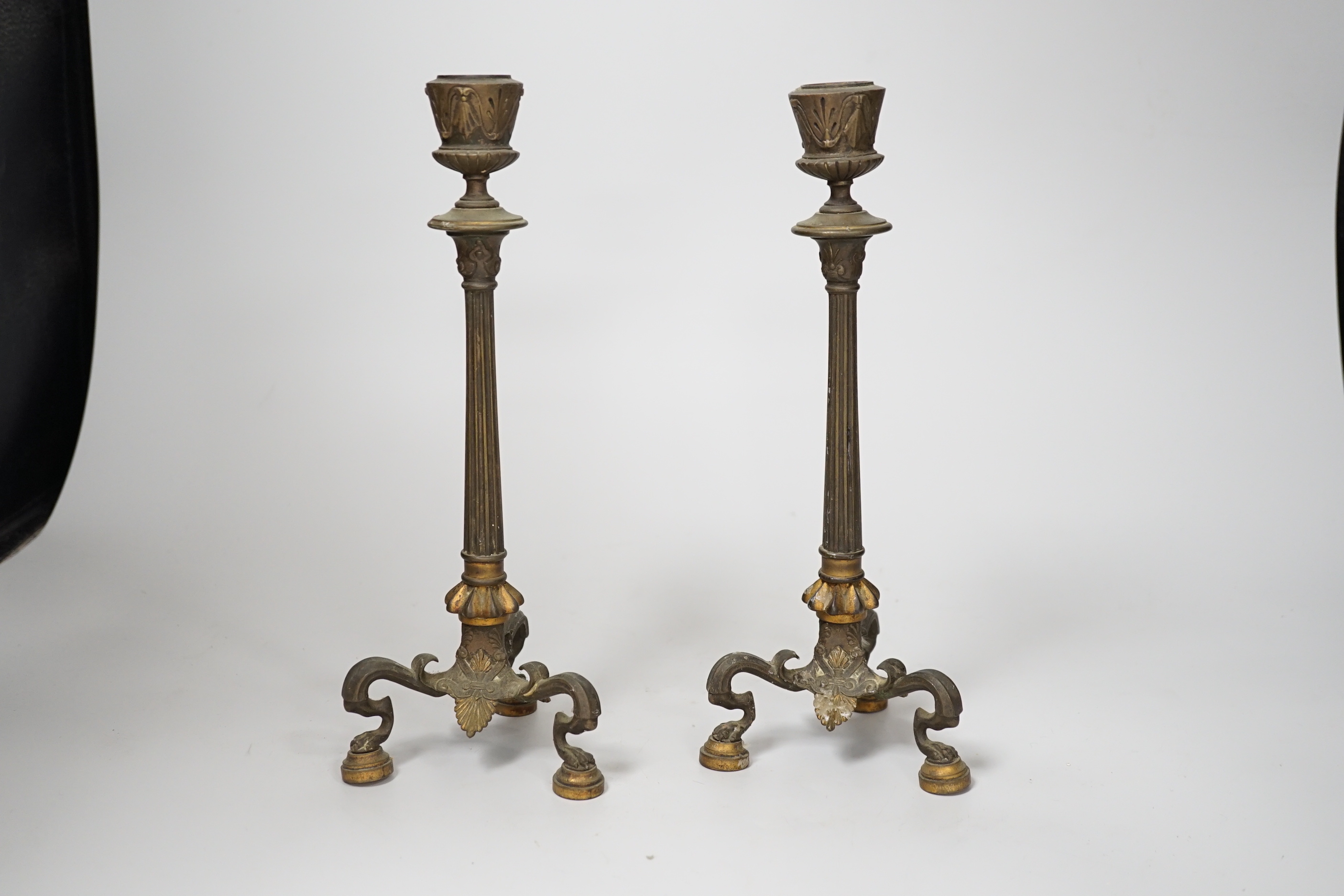 A pair of early 19th century brass candlesticks, 26cm